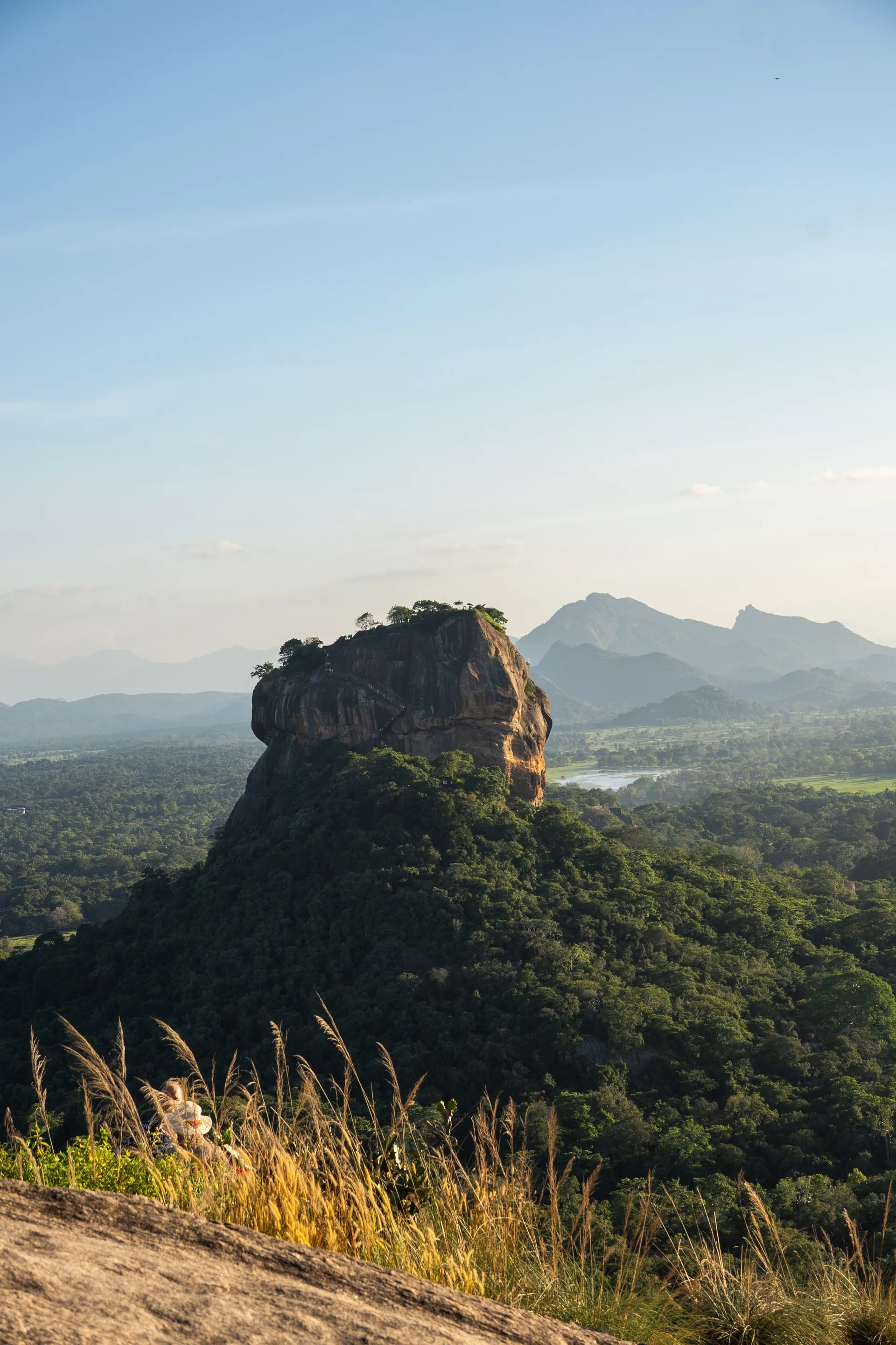 Sigiriya Rock Fortress viewed across the surrounding forests and mountains