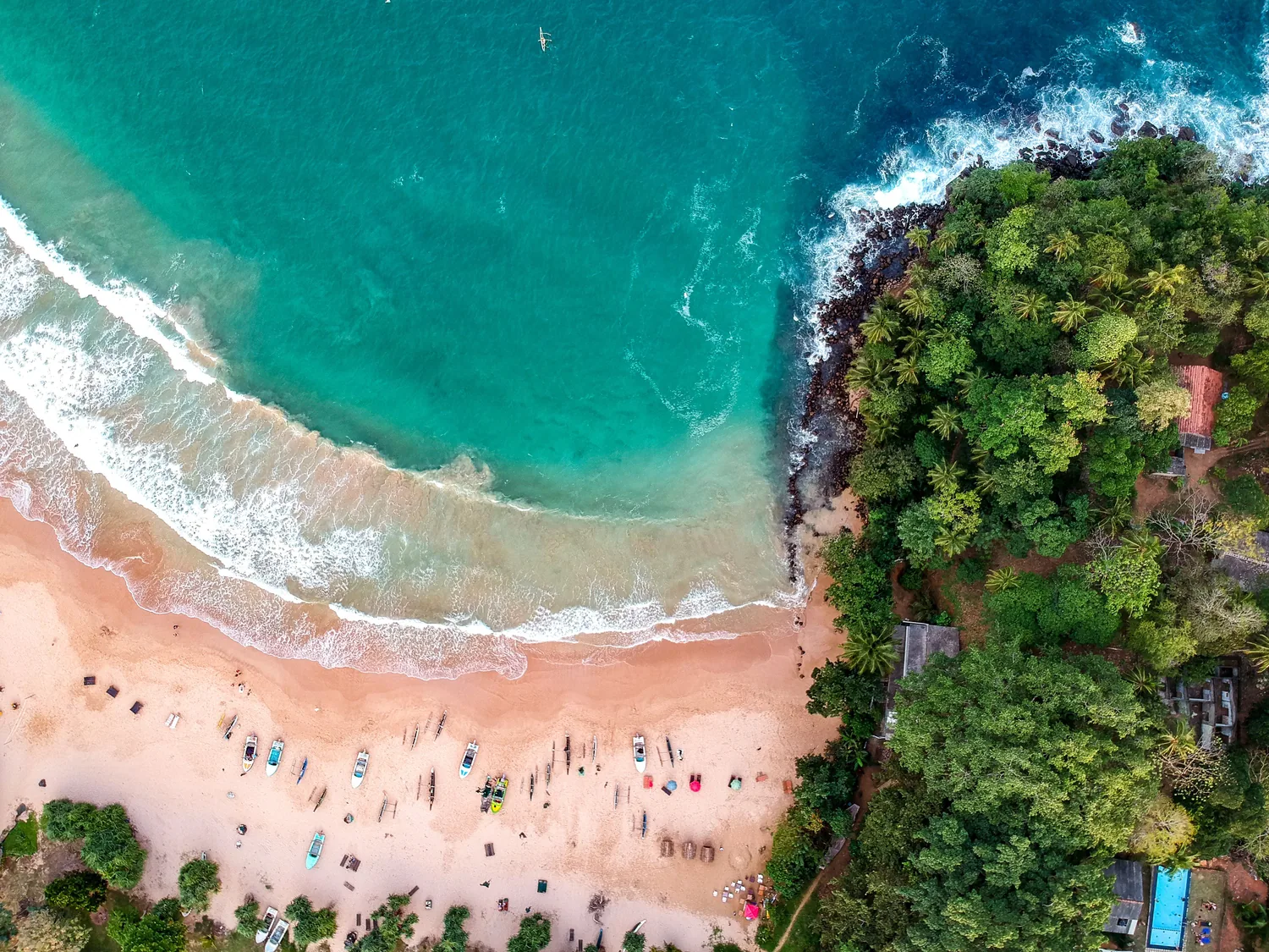 Turquoise water meeting a tropical beach in southern Sri Lanka